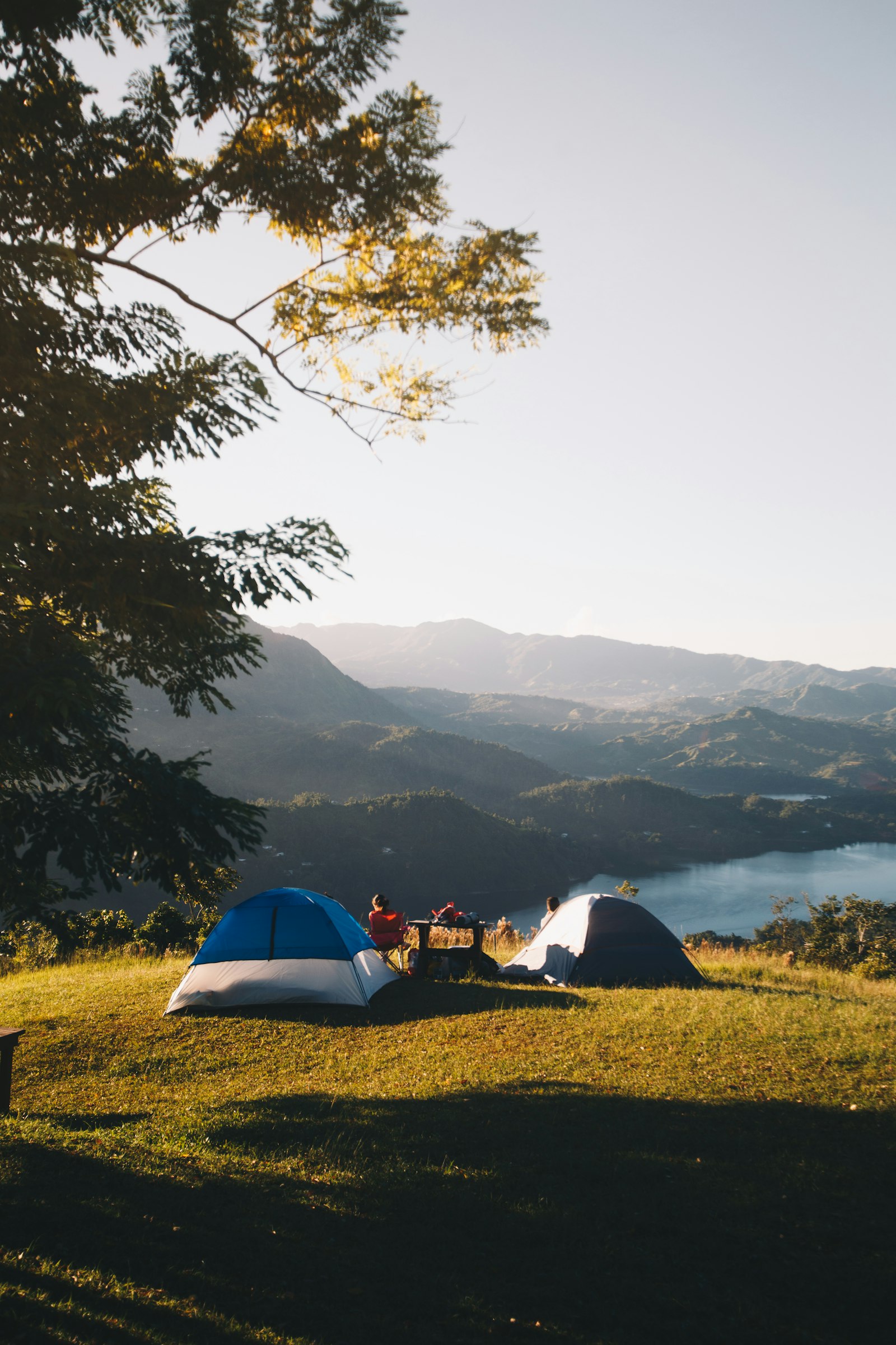 A camping spot on a mountain with views of a lake